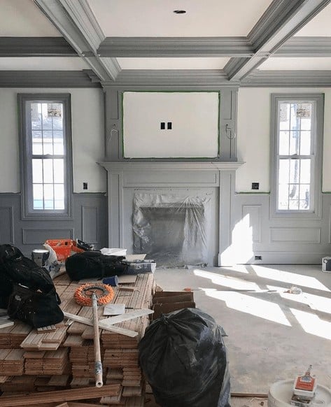 Dark gray contrasting millwork around fireplace