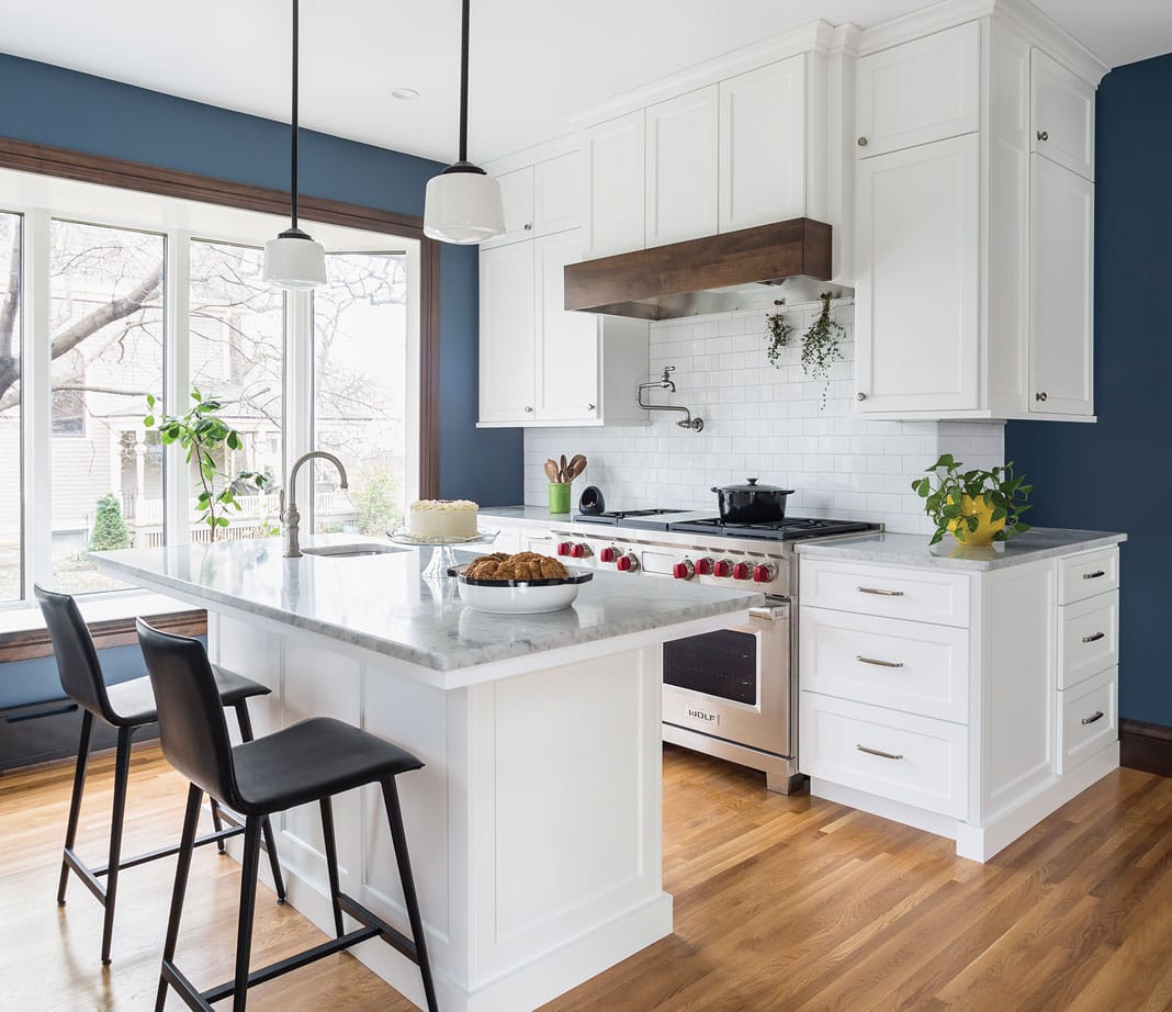 a kitchen with bright blue painted walls