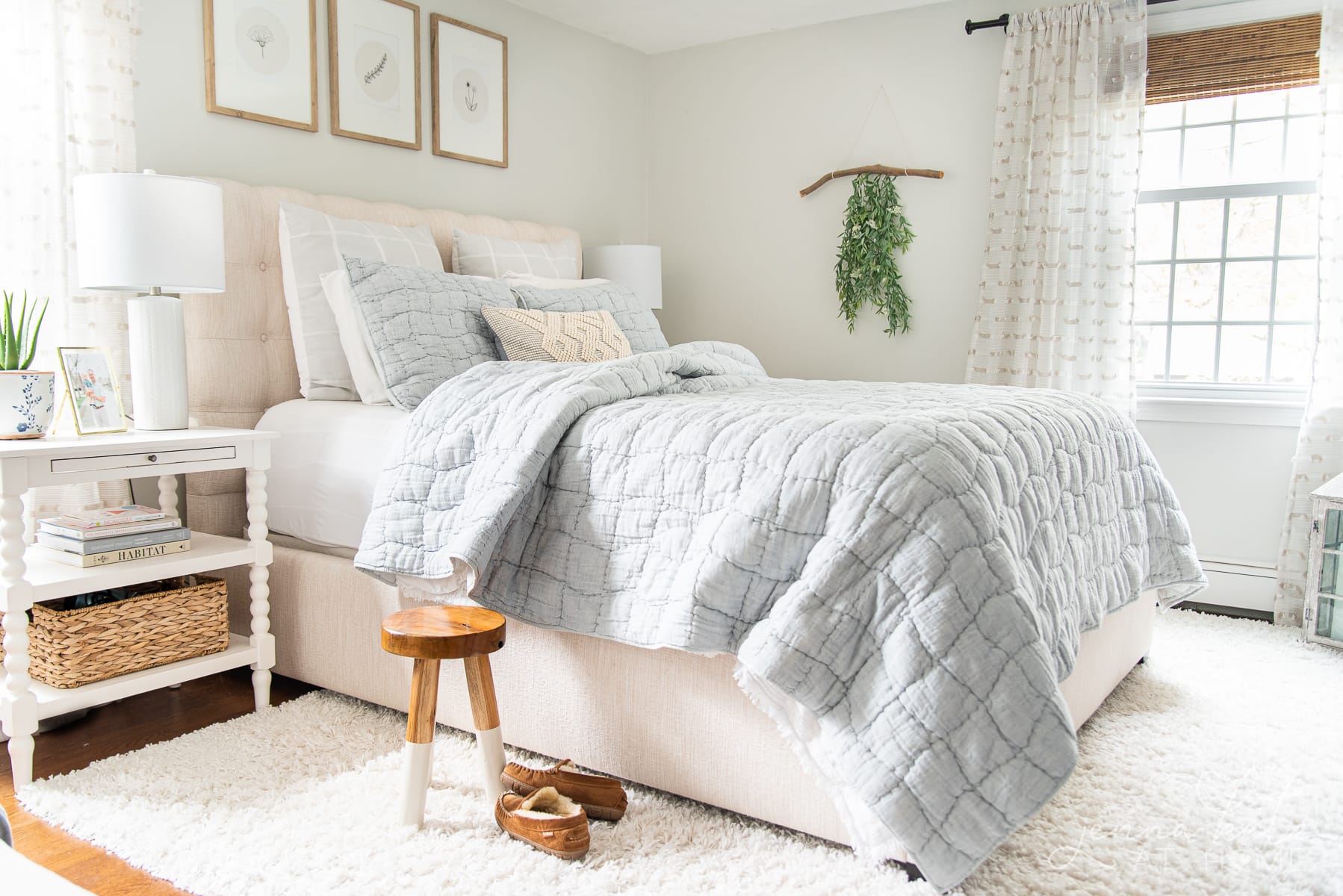 summer bedroom with light blue quilt 