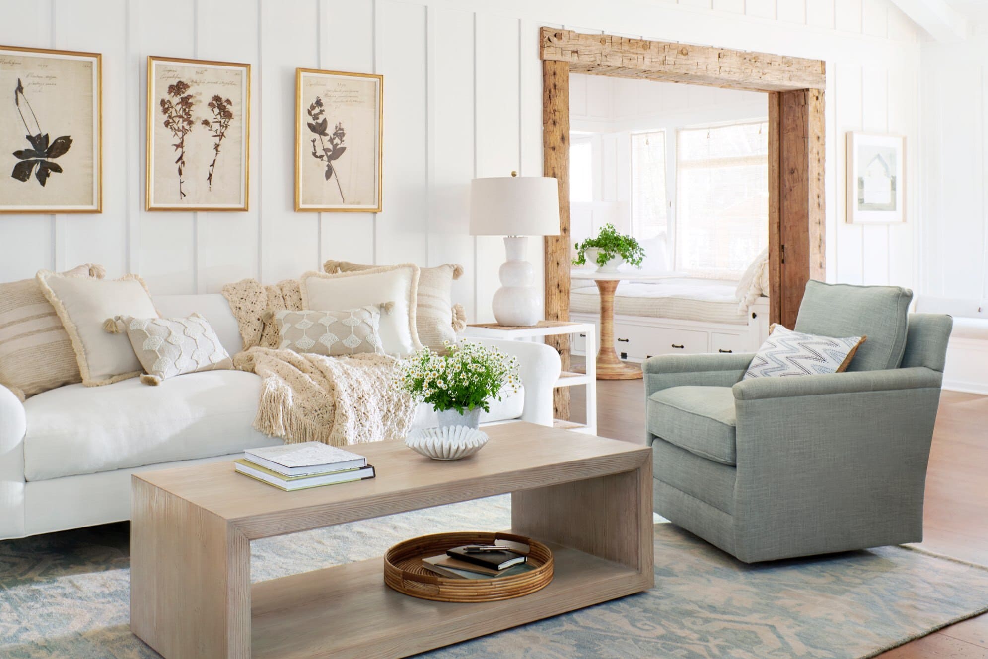 A living room filled with furniture and rustic wood cased opening