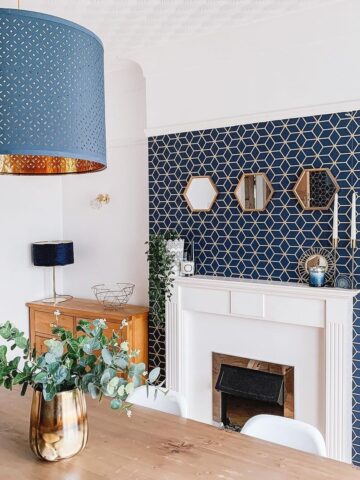 fireplace and wall with decorative wallpaper