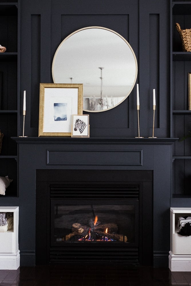 black painted accent wall with fireplace and built-ins