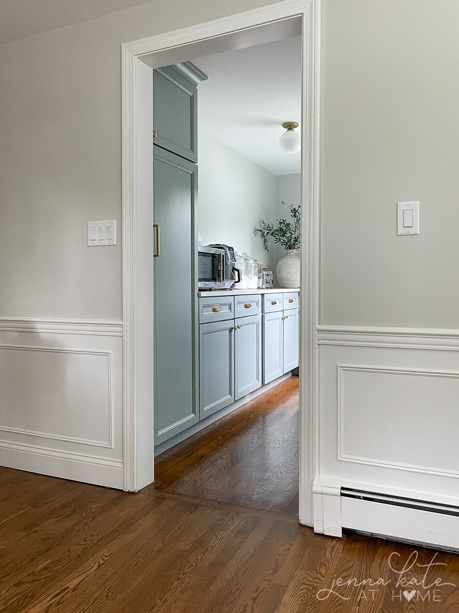 Walk in pantry with blue gray cabinets