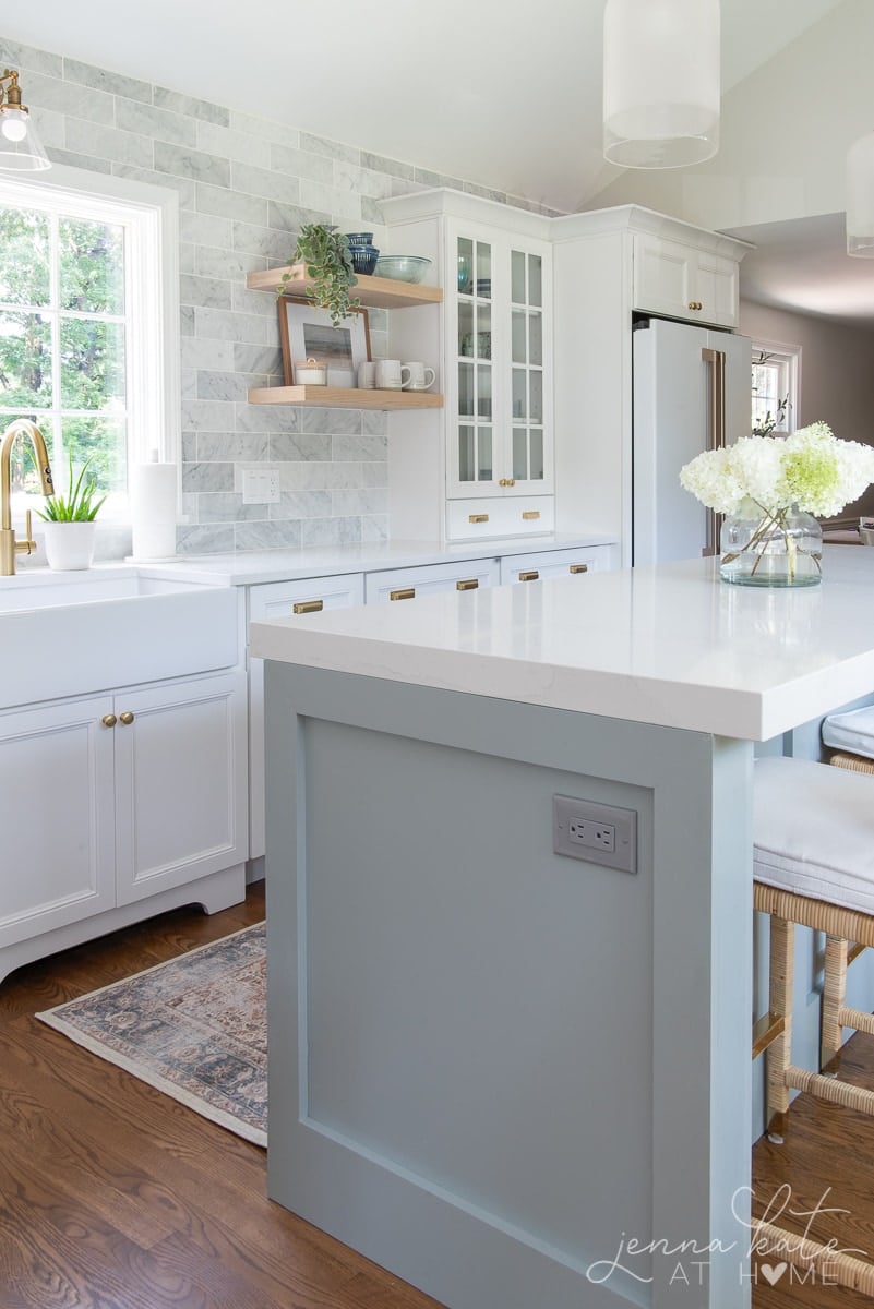 Silestone calacatta gold quartz countertops with mitered edge on island