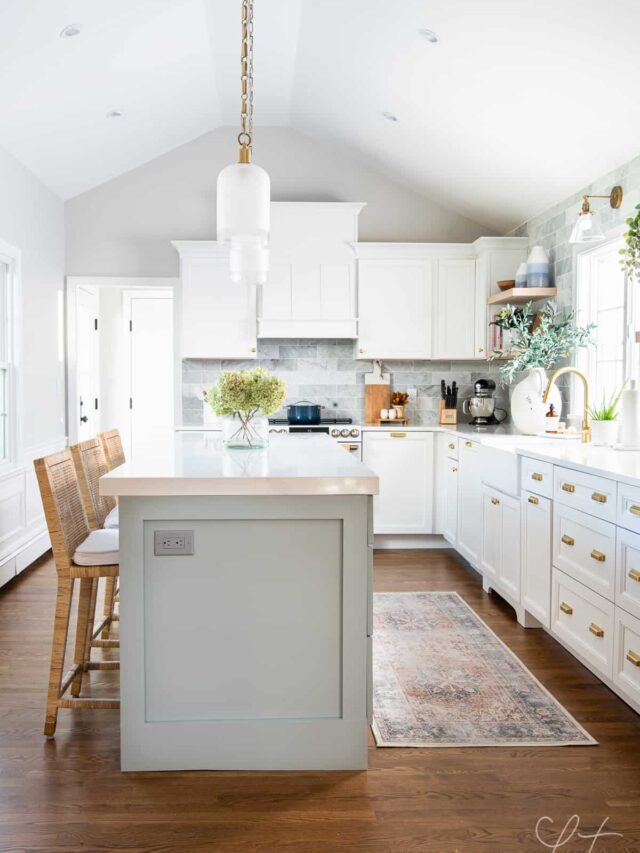 white kitchen cabinets with blue kitchen island