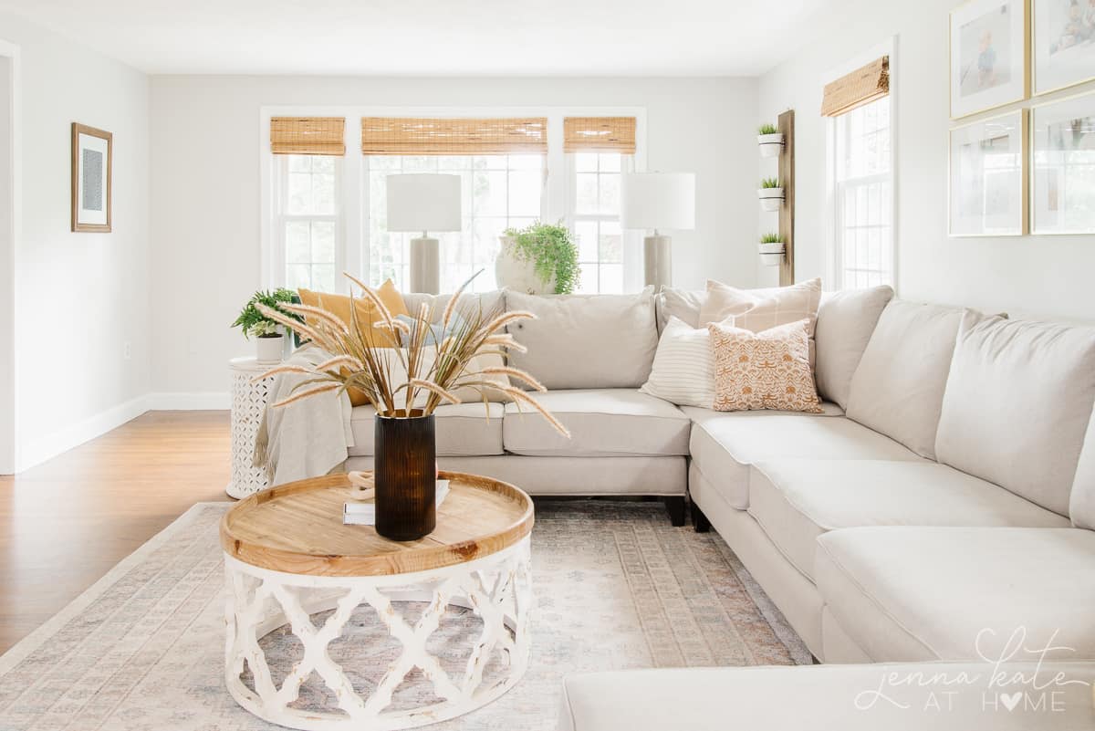 living room sectional and coffee table decorated for fall