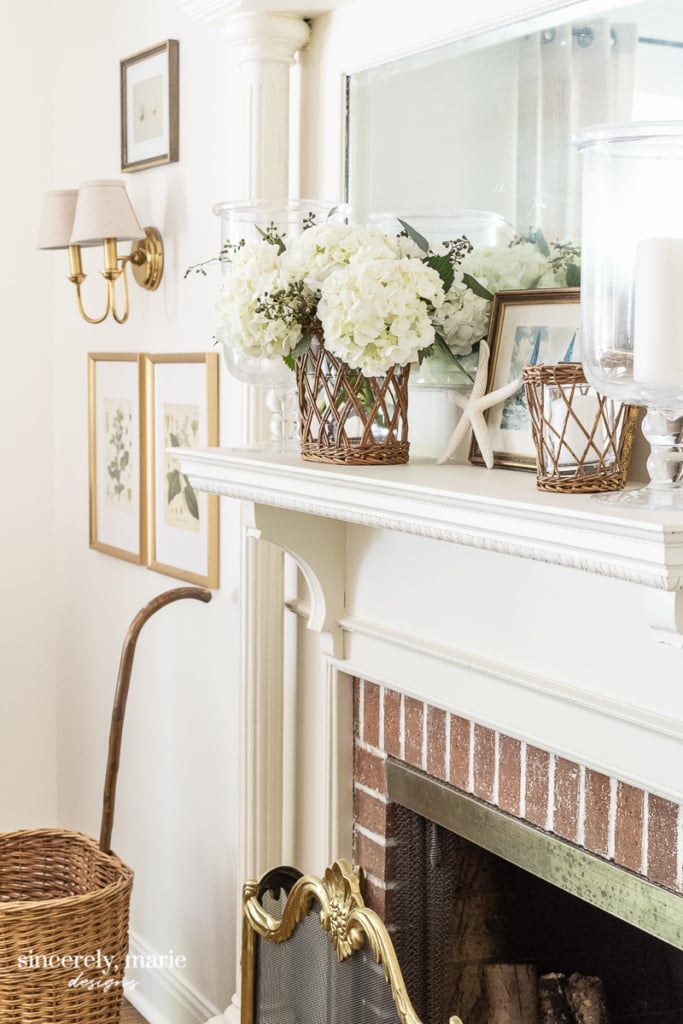 Fireplace mantel decorated with starfish and flowers