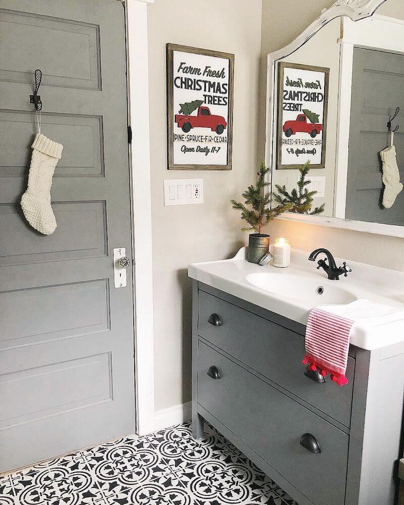 gray bathroom vanity and bathroom door with minimal Christmas decor