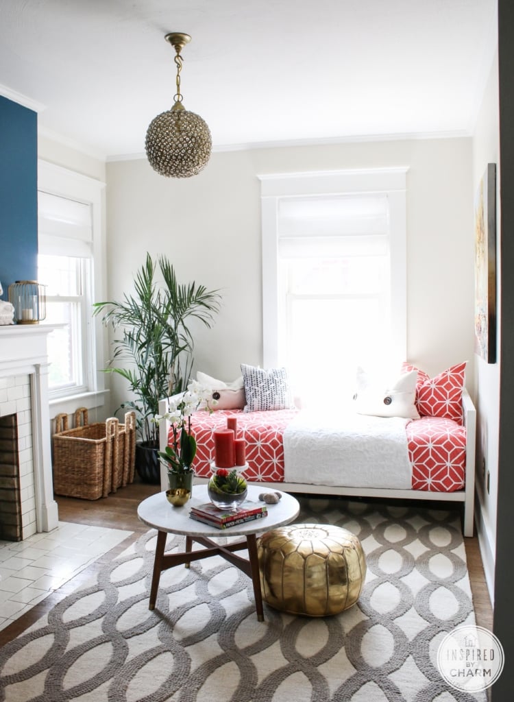 daybed with coral bedding and walls behind painted Shoji White.