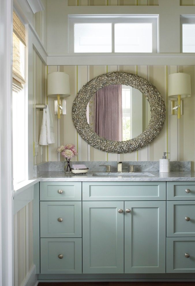 sherman williams Rainwashed on built in bathroom cabinets with capiz shell mirror above it