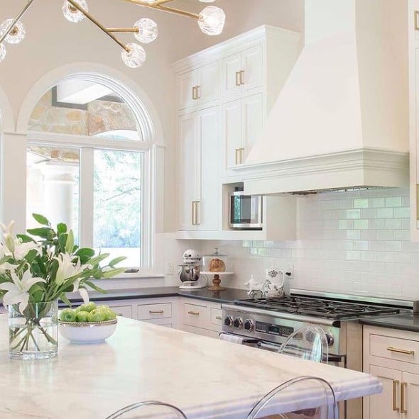 SW white Kitchen Cabinets painted with Greek Villa paint subway tile gold lighting