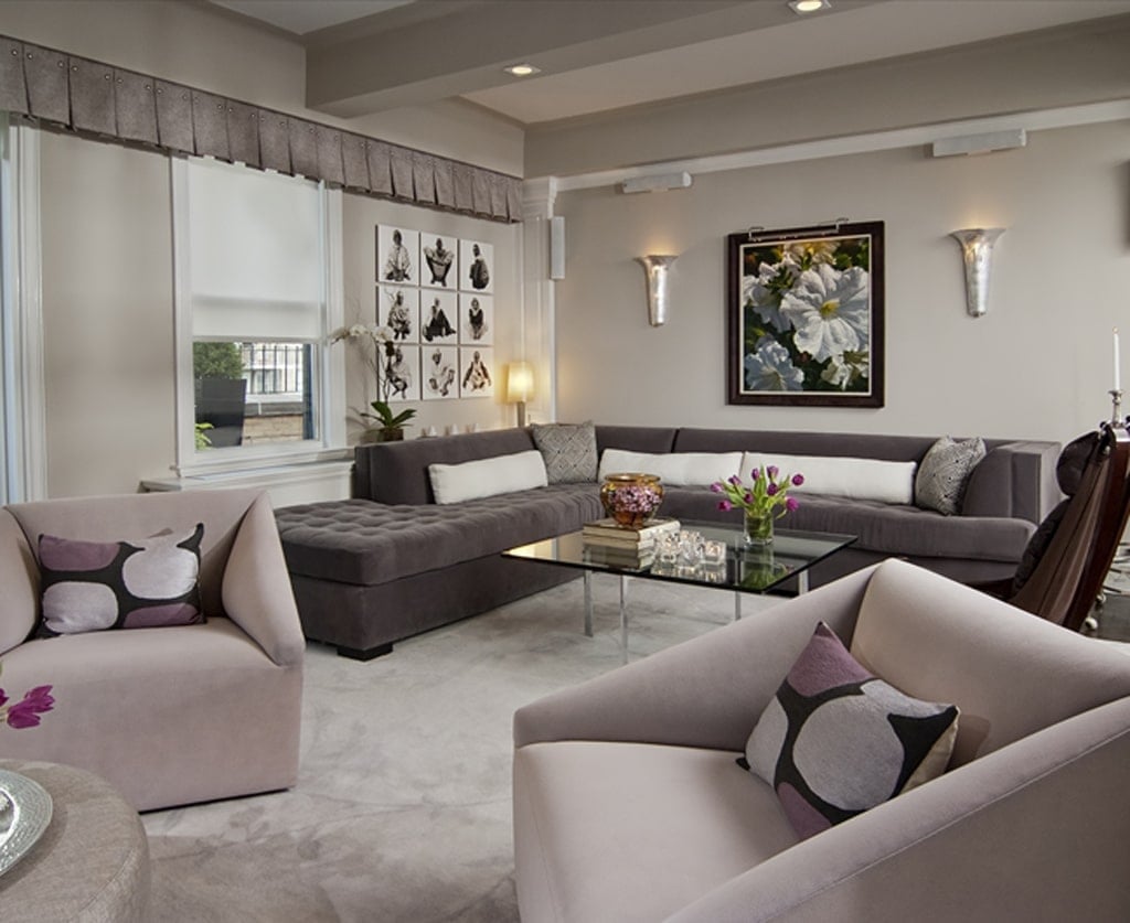 Neutral brown and gray living room with large sectional with walls painted SW Alpaca