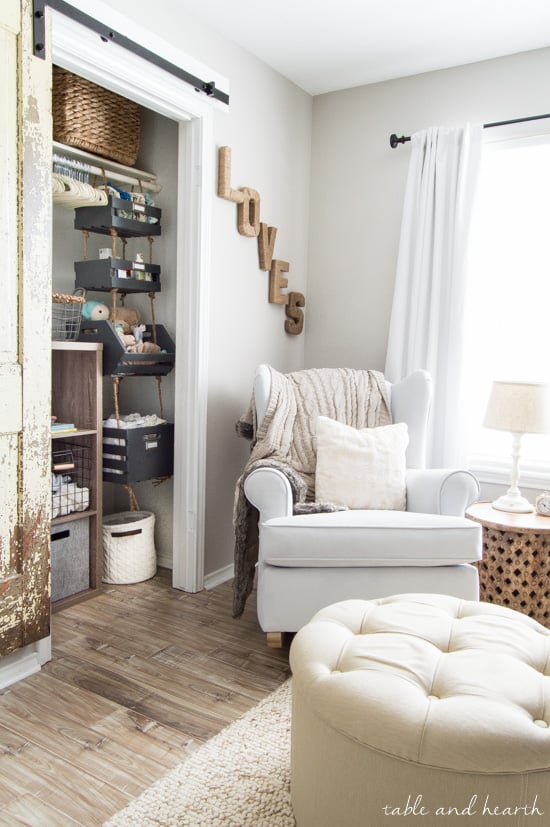 gender neutral nursery with closet and chair near window with walls painted SW Alpaca