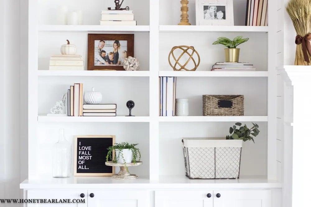 bright white built in shelves with a variety of decorative items