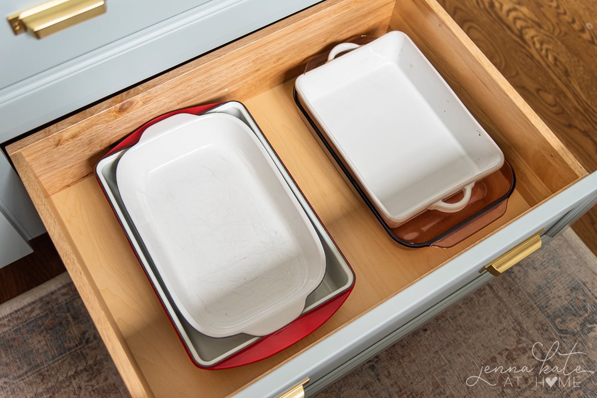 organized casserole dishes in a base cabinet drawer