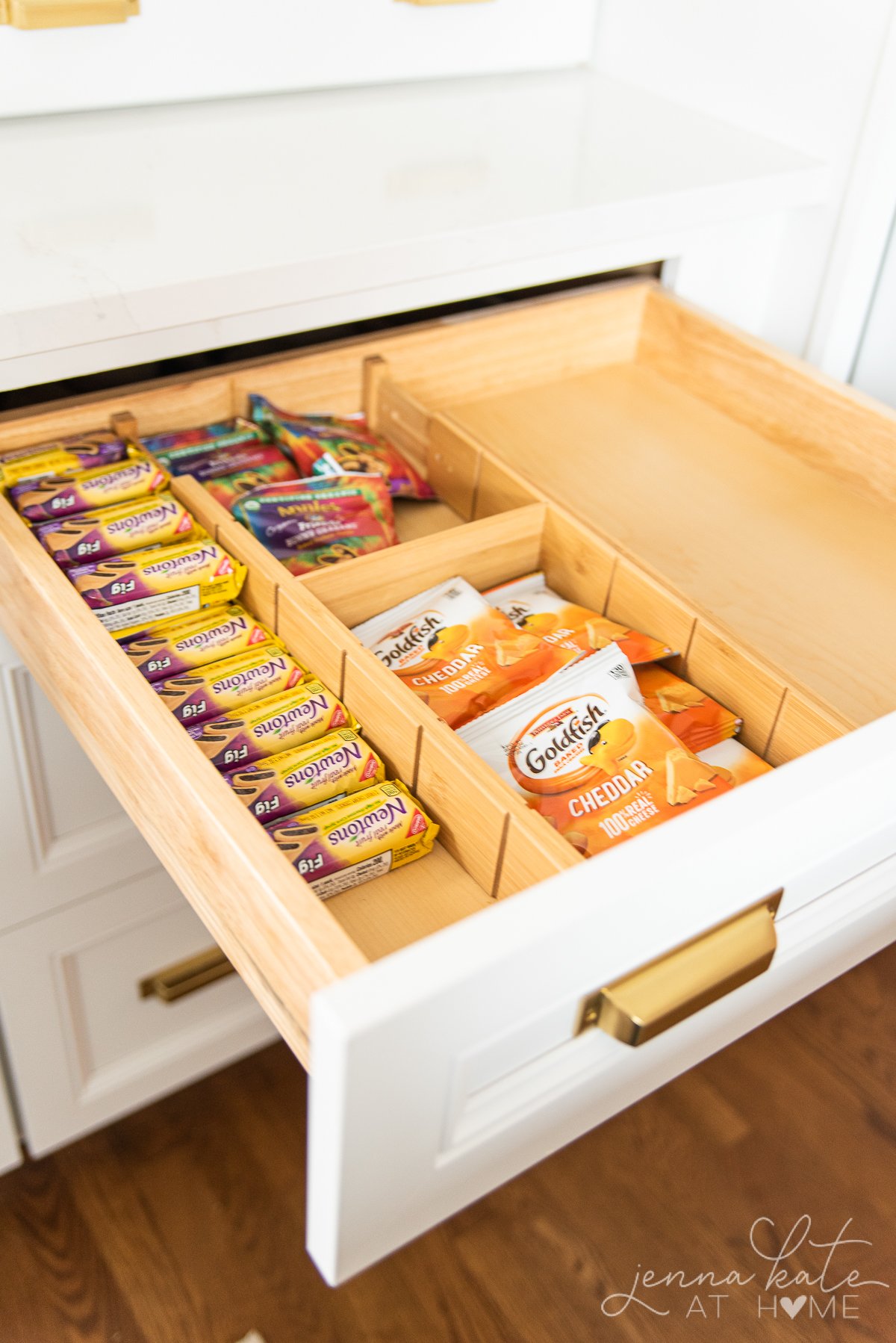 kids snacks organized in a drawer and separated with bamboo dividers