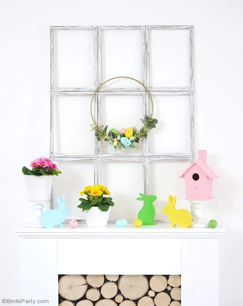 beautiful pastel spring mantel with colorful bunnies and eggs