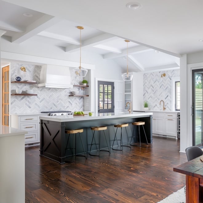 Beautiful white kitchen with bold island painted Tricorn Black.