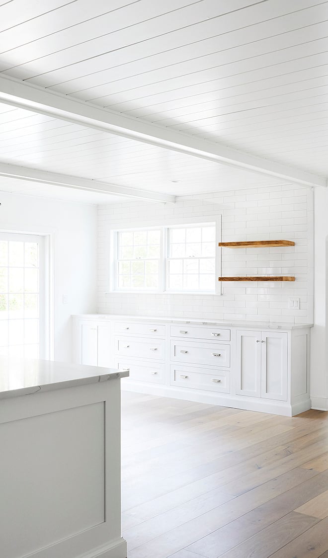 all white kitchen with marble countertops