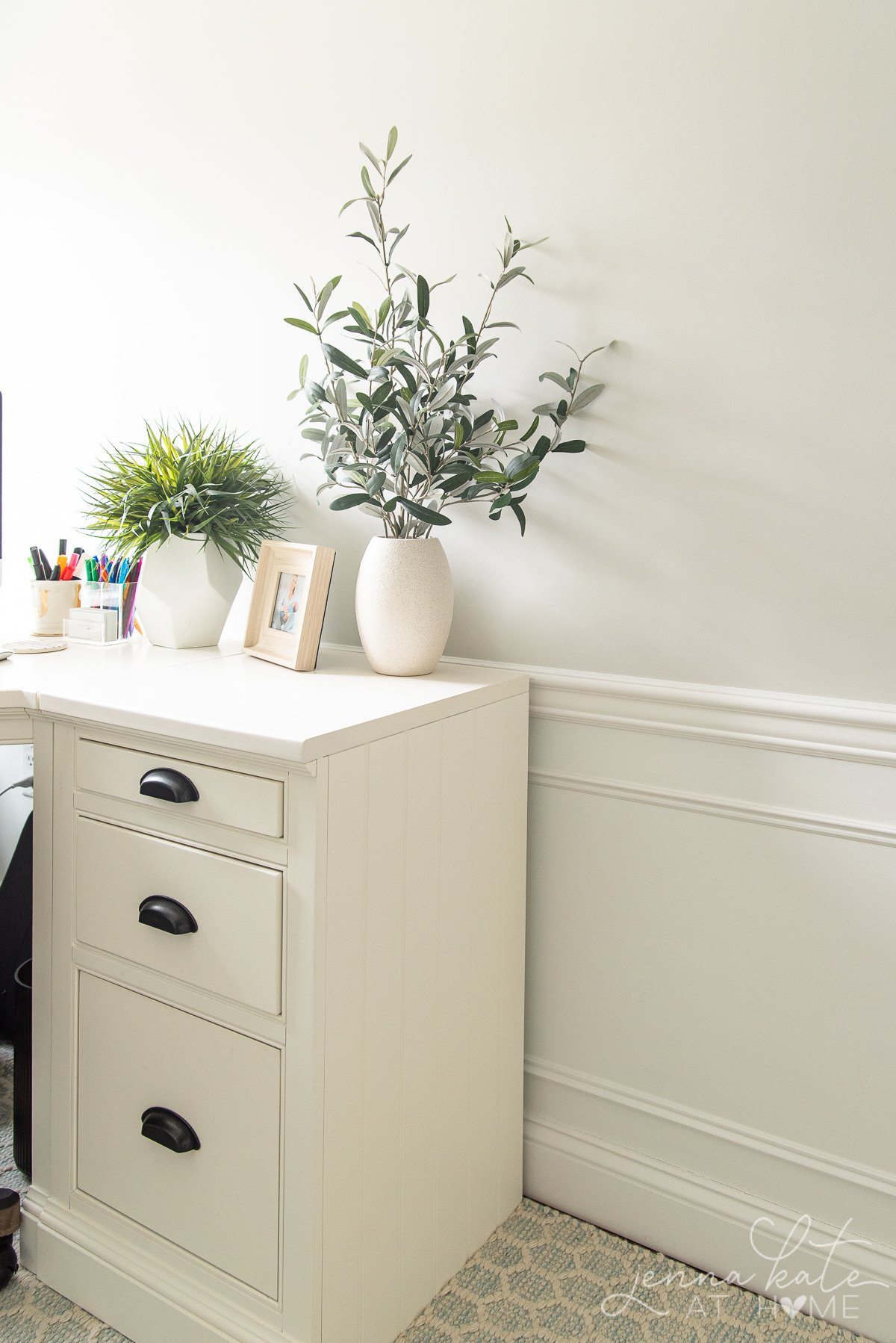 office desk with plants on it showcasing the paint color on the wall behind it