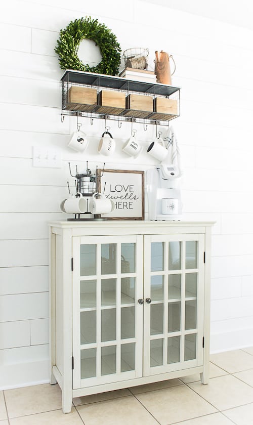 white farmhouse coffee bar with clear glass cupboard cabinets