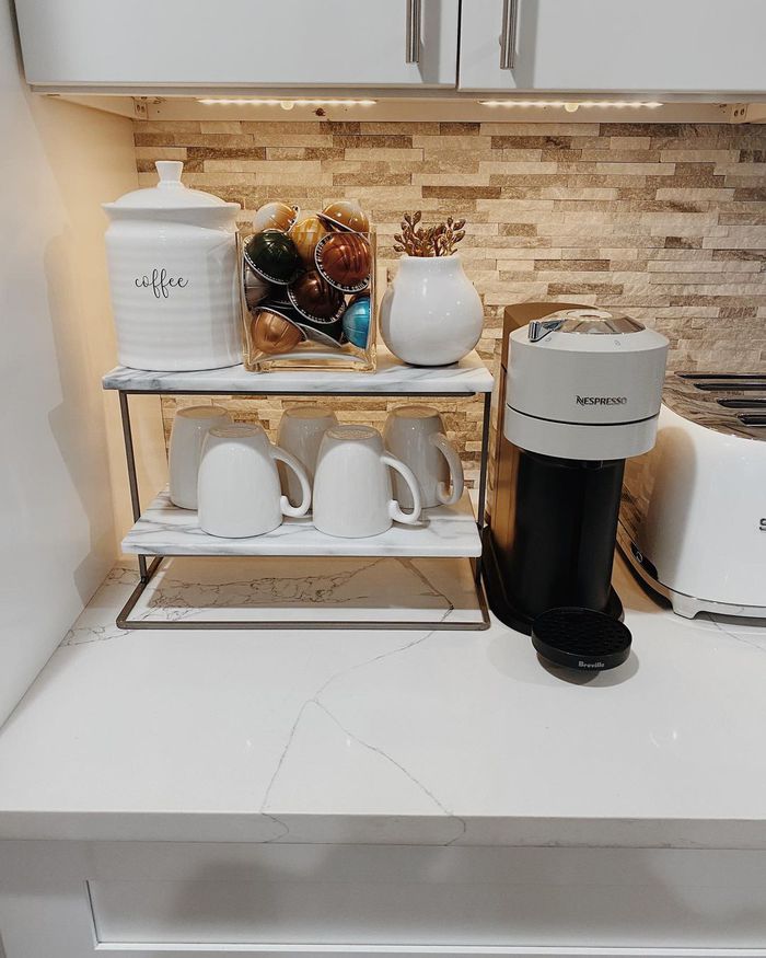 countertop coffee bar station with small shelving unit