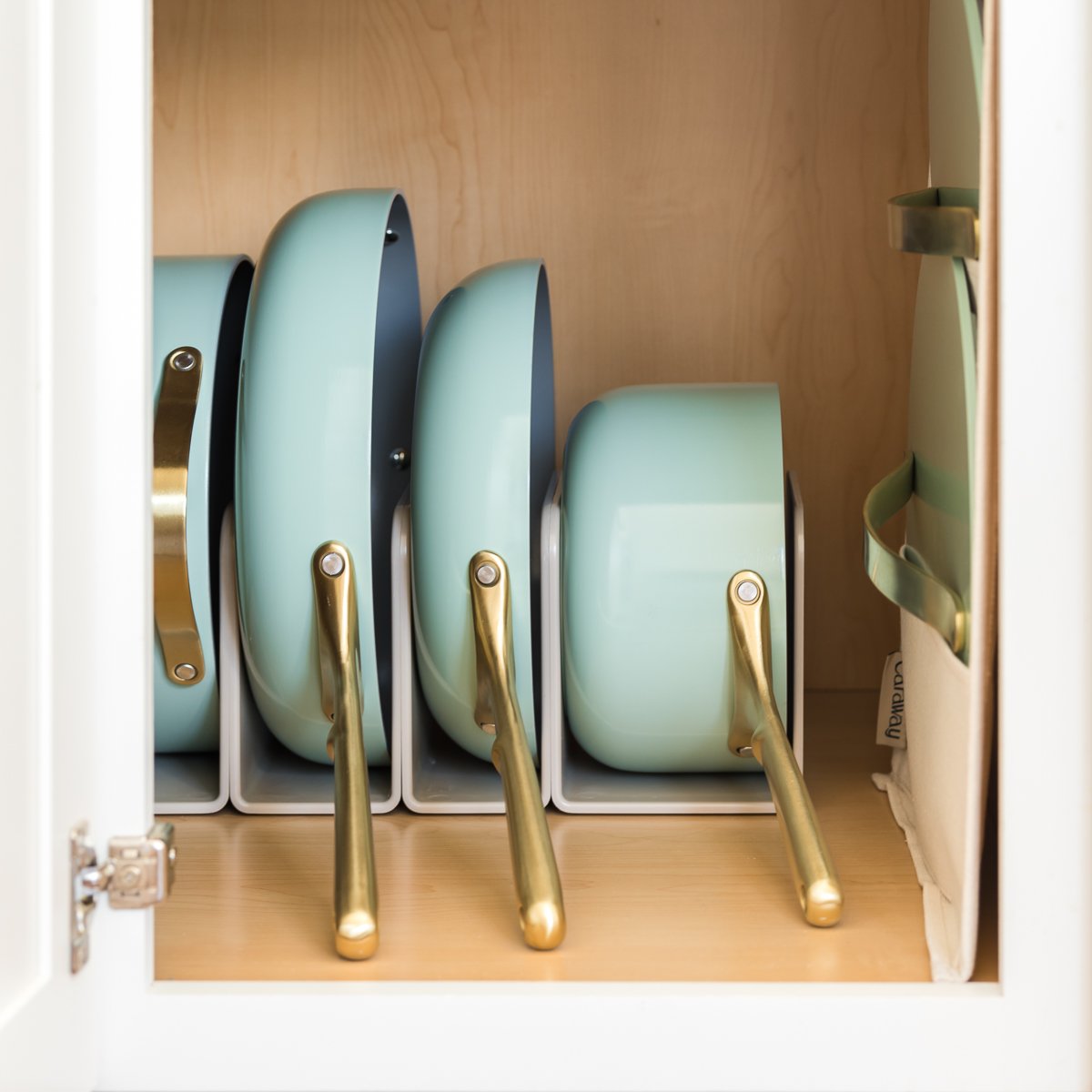 pots and pans organized in a cabinet cabinet