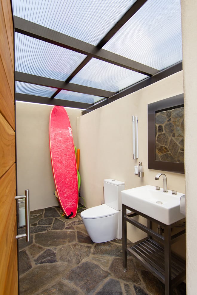 stone floor with glass ceiling and surfboard decor