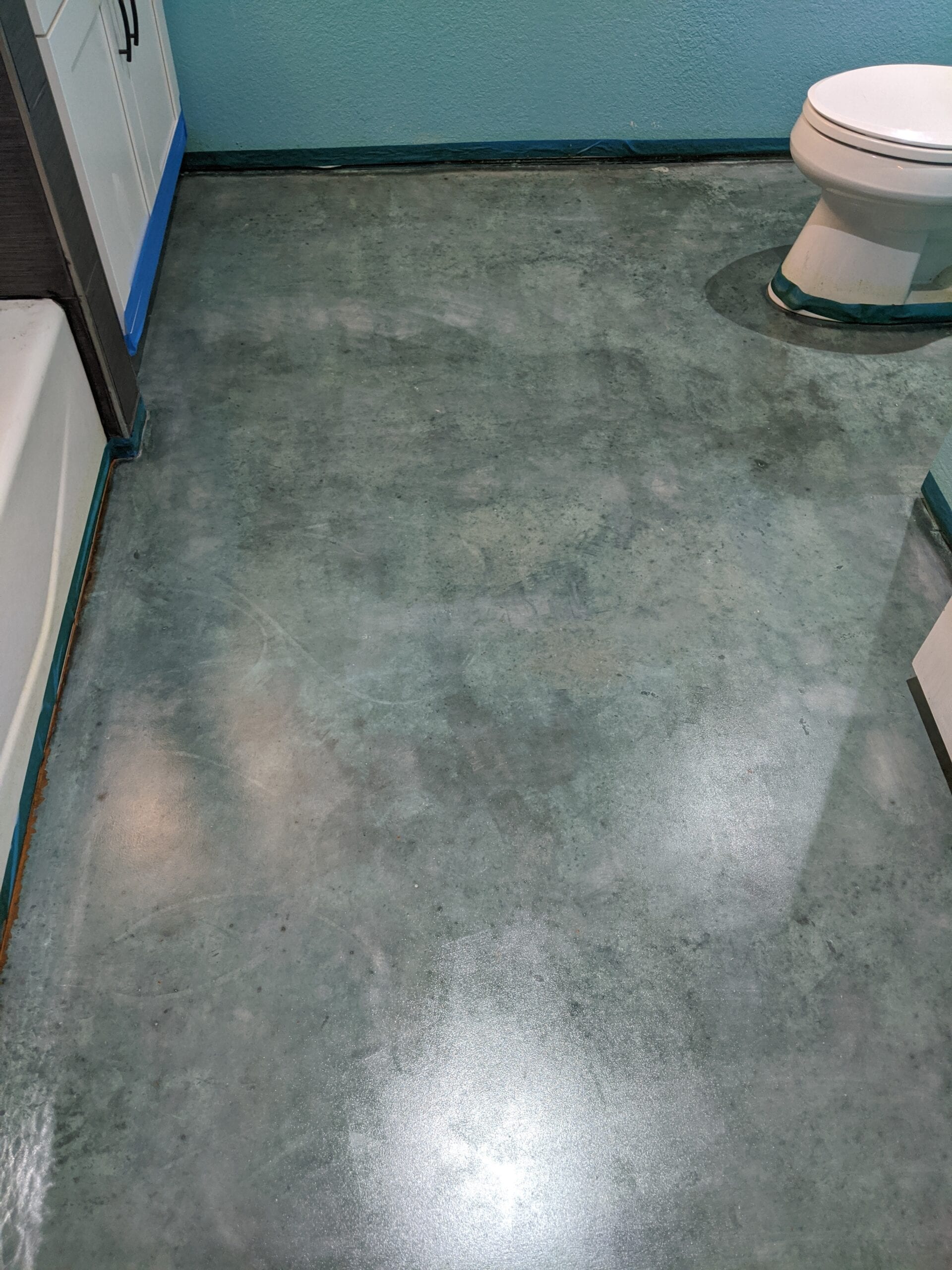blue concrete stained bathroom floor