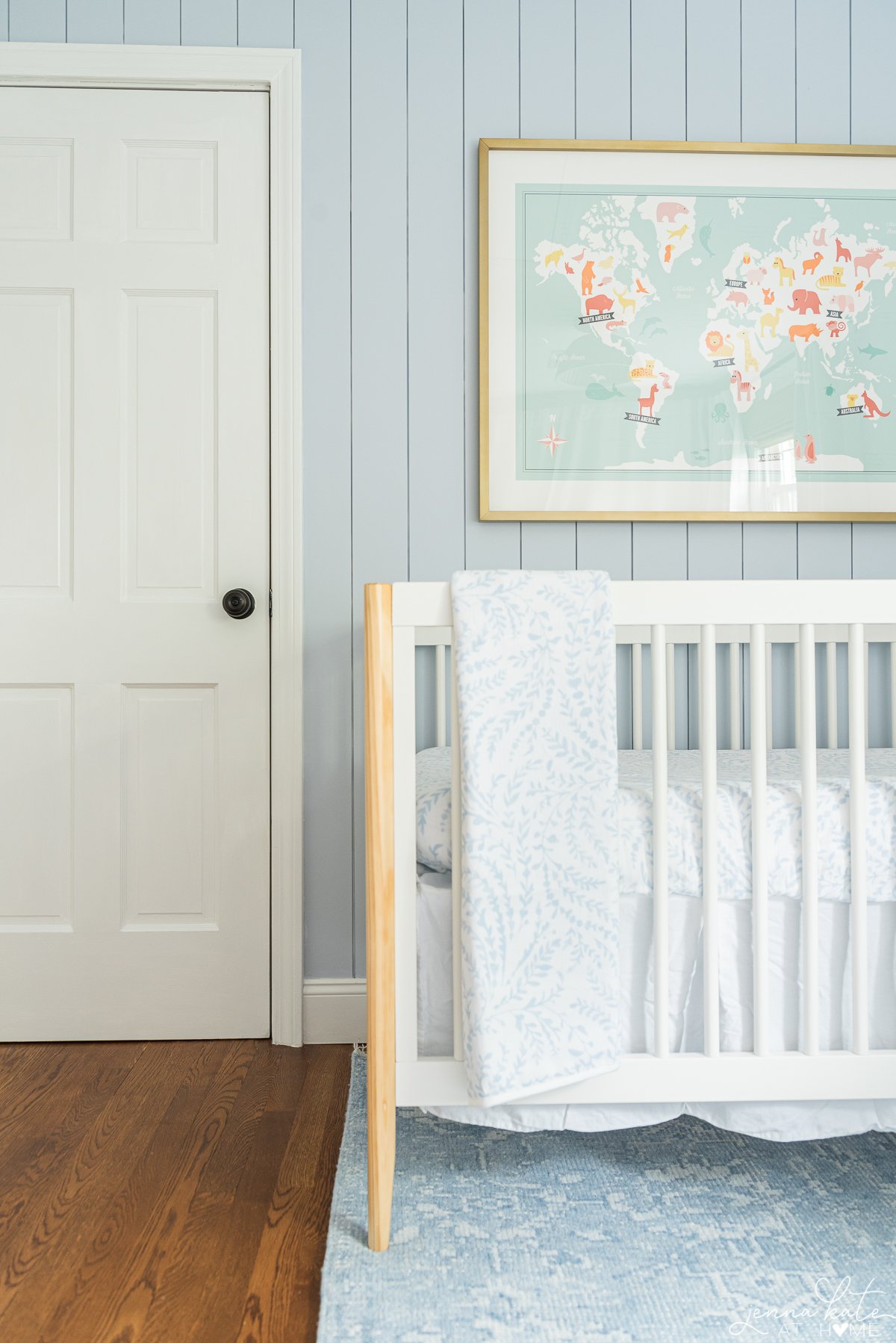Calming little boy's nursery with Sherwin Williams Mild Blue paint on the walls. 