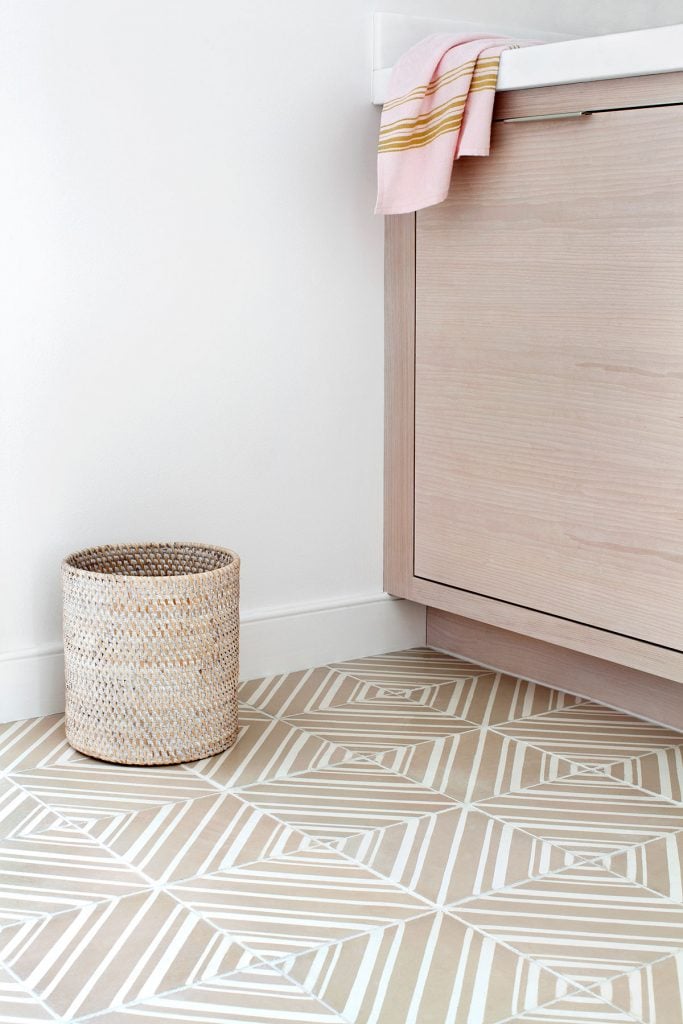 handmade, patterned ceramic floor tile in small bathroom