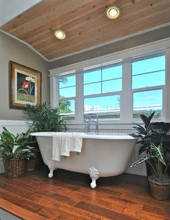 bathroom room box with hard wood flooring and white bathtub large window 