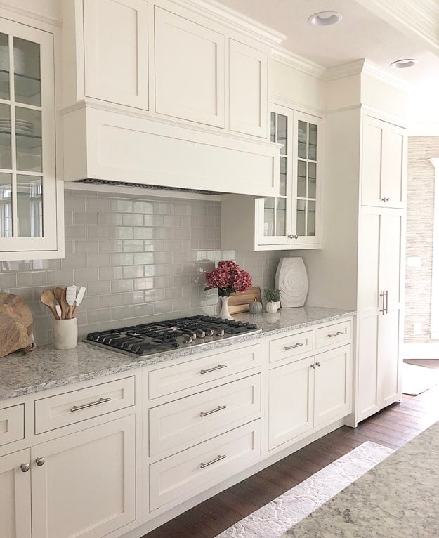 white dove inset kitchen cabinets with gray countertops and nickel cabinet hardware