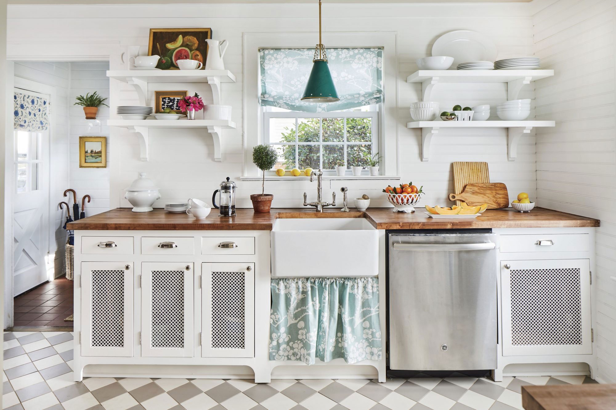 kitchen with white cabinets and white beadboard backsplash