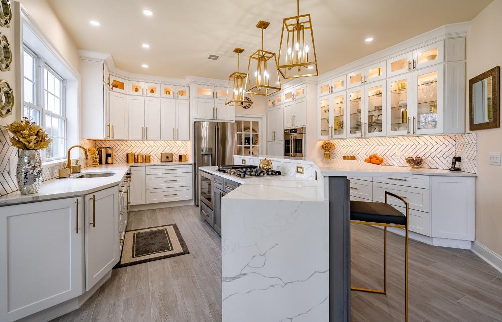 White Kitchen cabinets with vertical herringbone design and dark grout