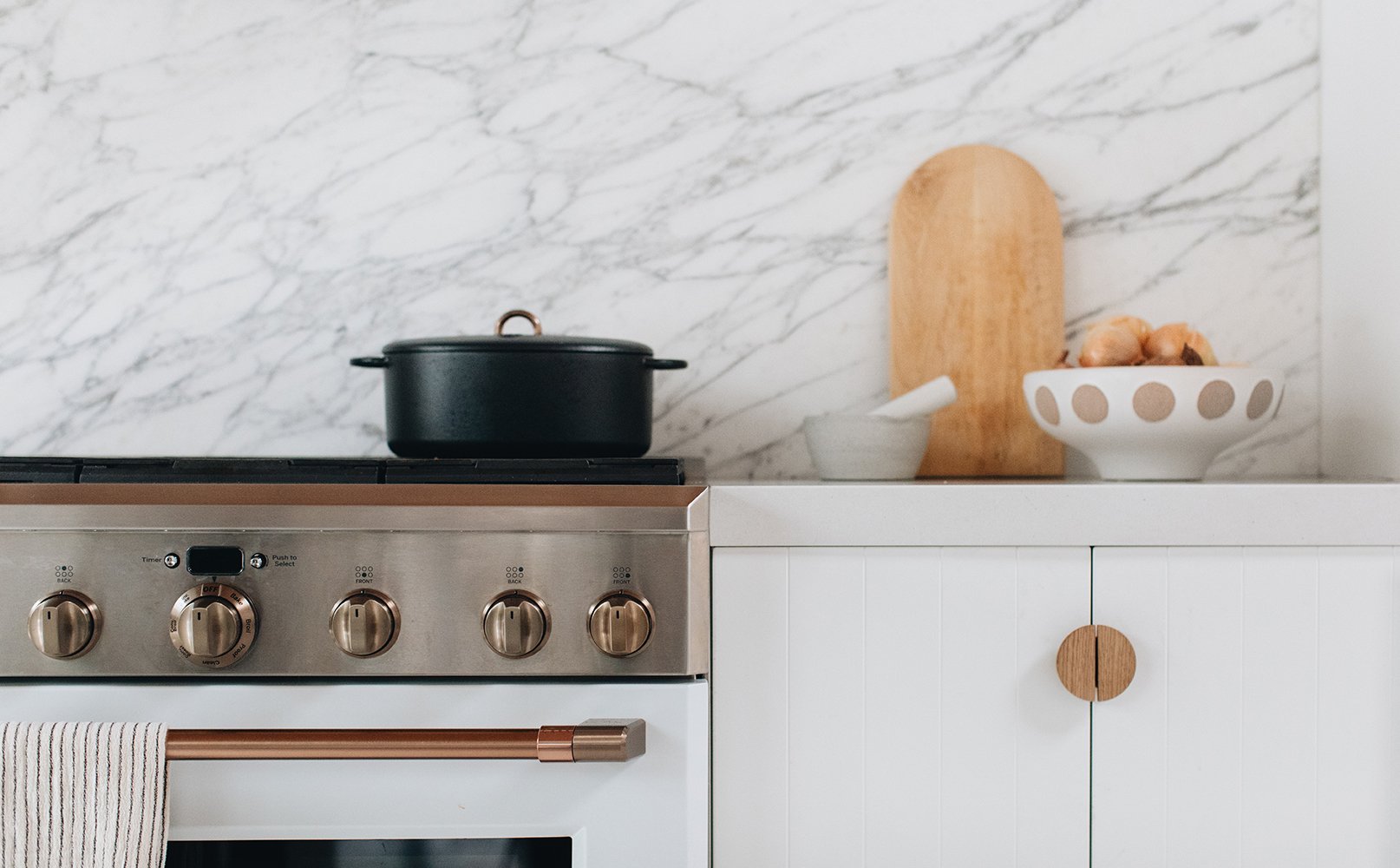 Marble Slab Kitchen Backsplash that goes with white cabinets.