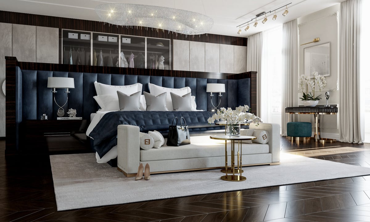 bedroom with dark wood floors and tufted navy blue headboard