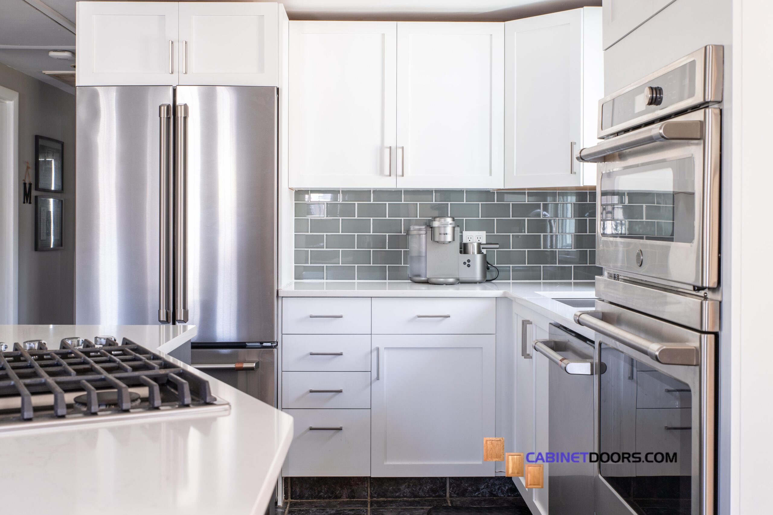 modern kitchen with cabinets painted high reflective white