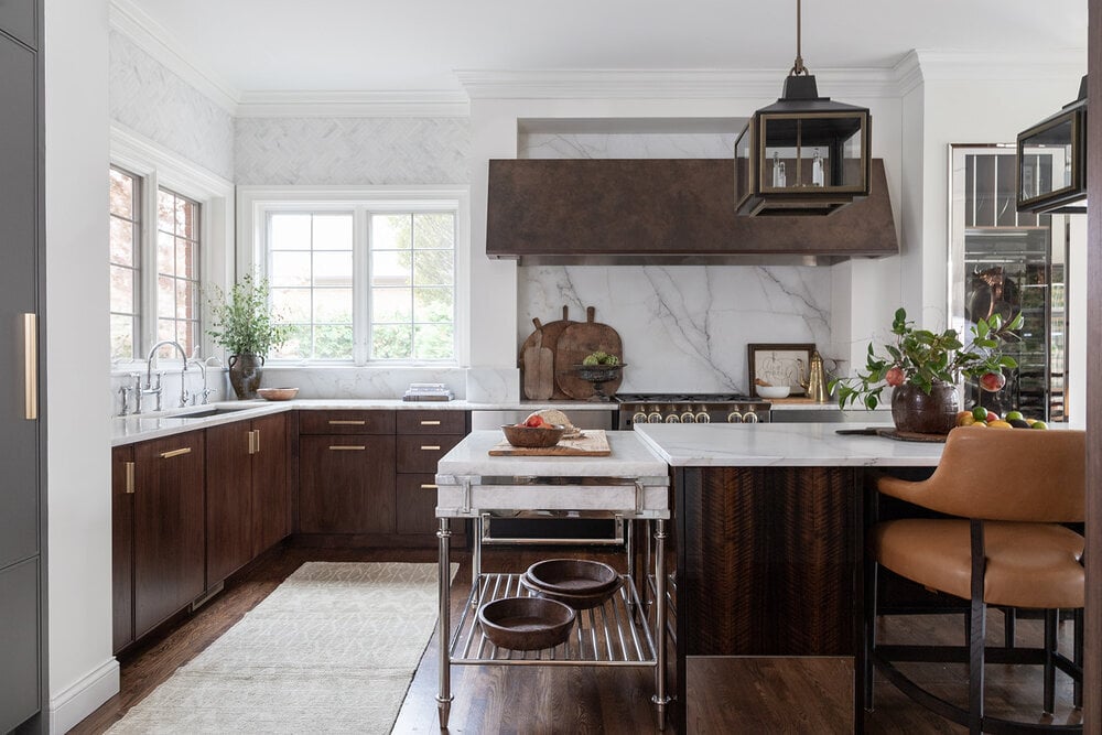 dark wood countertops and marble counter and backsplash to the ceiling