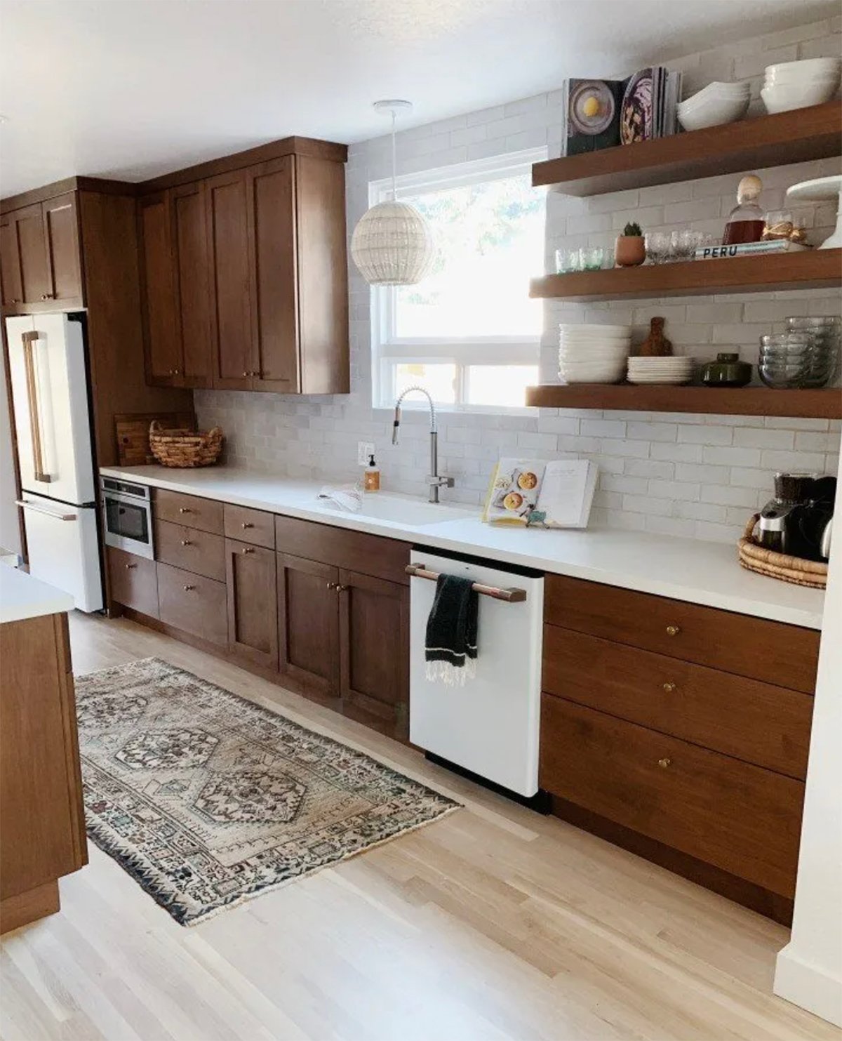 warm wood cabinets with white countertops and wooden floating shelves