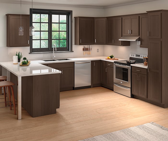 traditional dark wood kitchen cabinets with stainless steel appliances