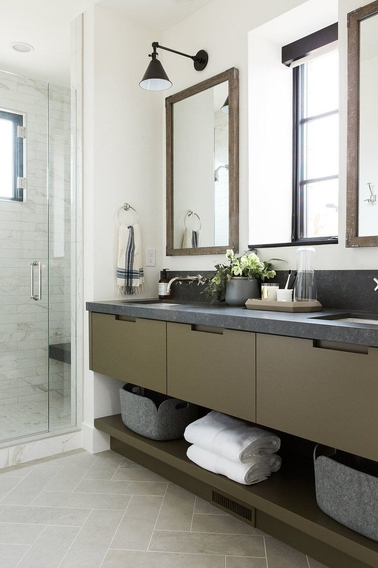 Benjmain Moore Tate Olive painted vanity cabinet in a bathroom with grey shelving.