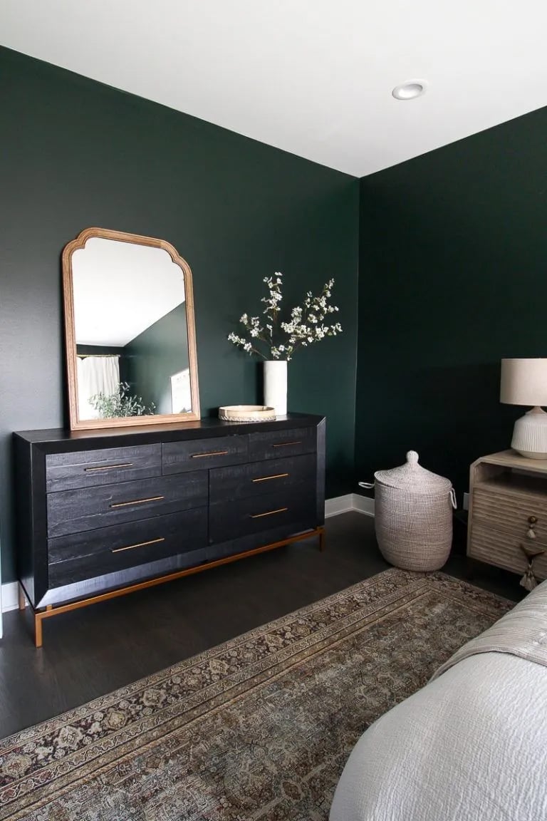 A bedroom with walls painted in benjamin moore essex green