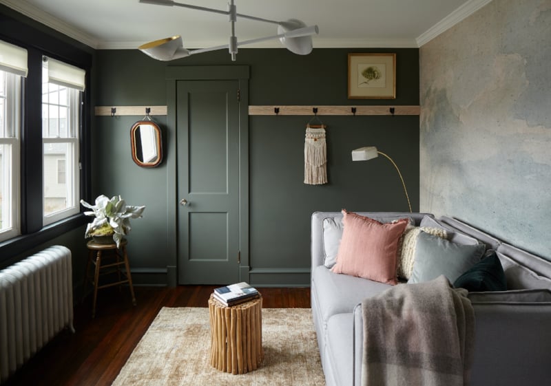 room with green walls and daybed