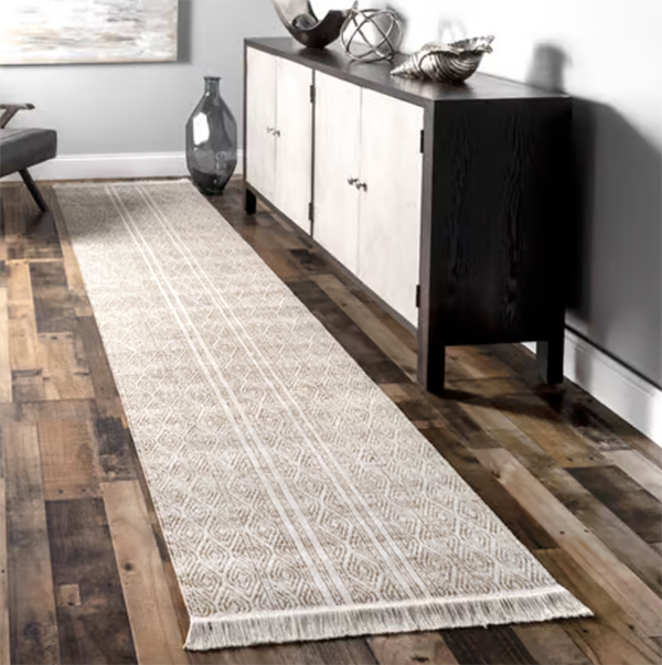 kitchen runner on hardwood floor next to a sideboard