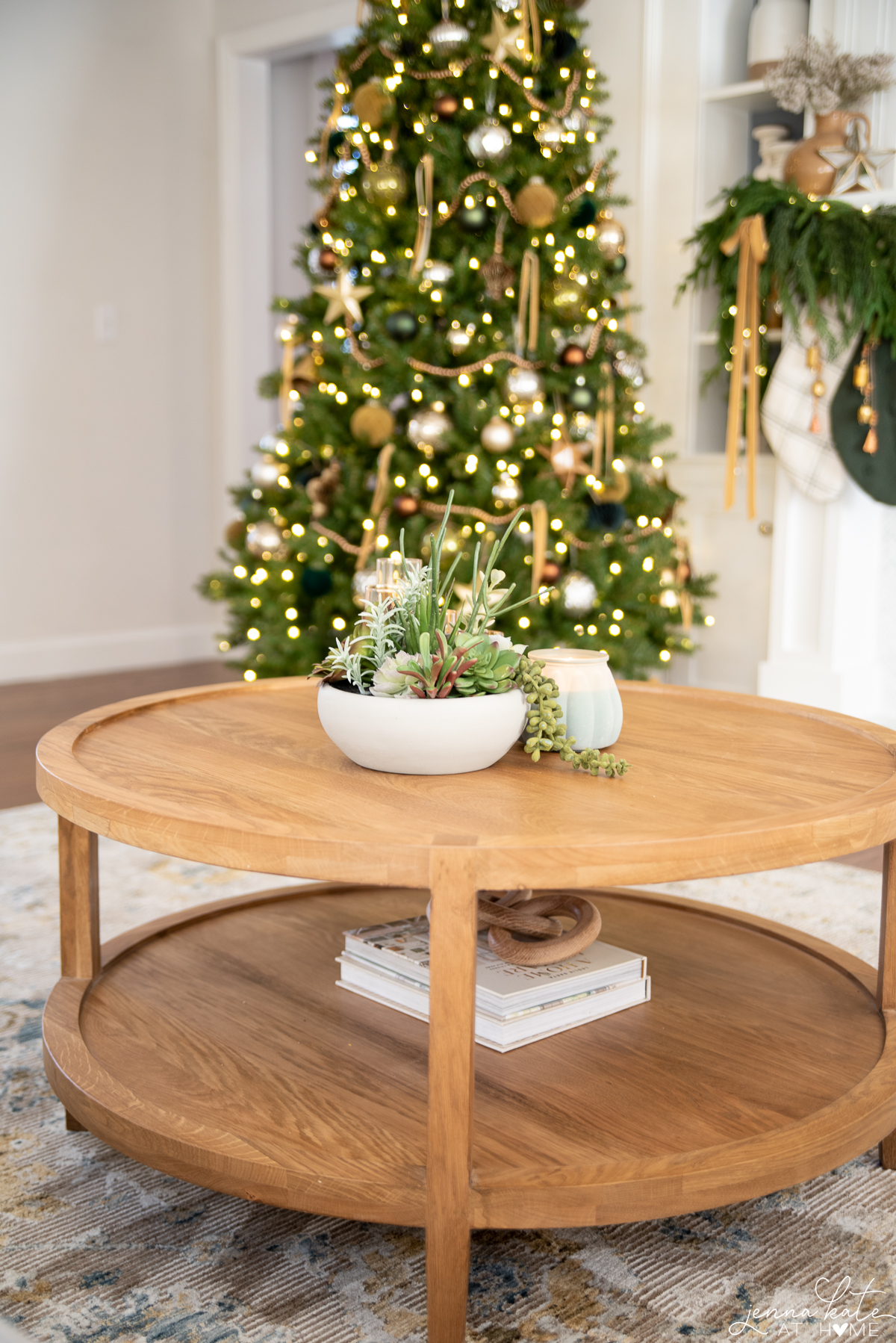 round wooden coffee table with plants on top