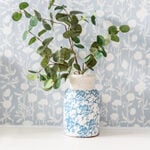 blue vase with eucalyptus stems