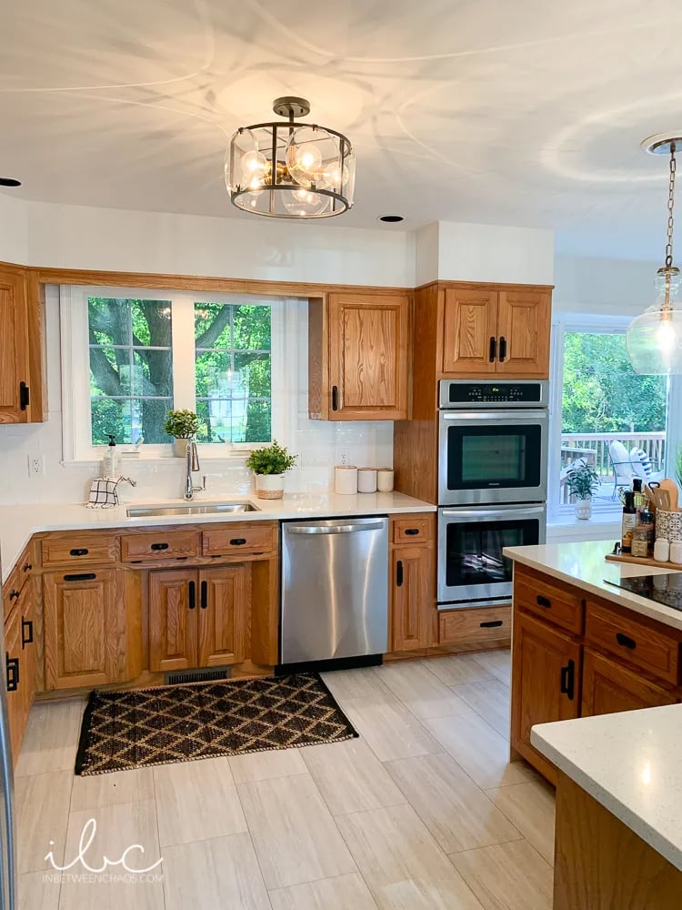 kitchen with oak cabinets and white walls