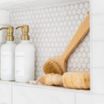 shampoo niche in a shower with pretty bottles