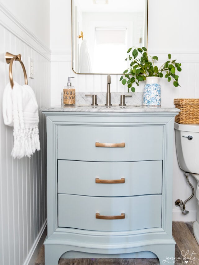 blue bathroom vanity with mixed metals